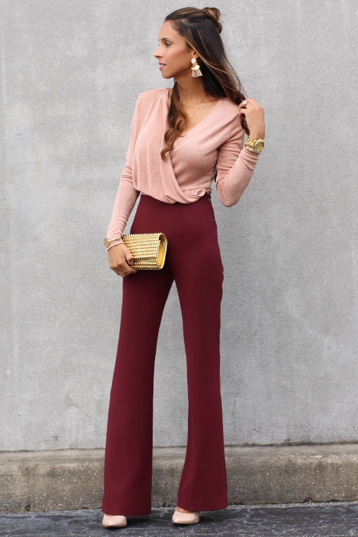 blush bodysuit paired with burgundy high-waist pants