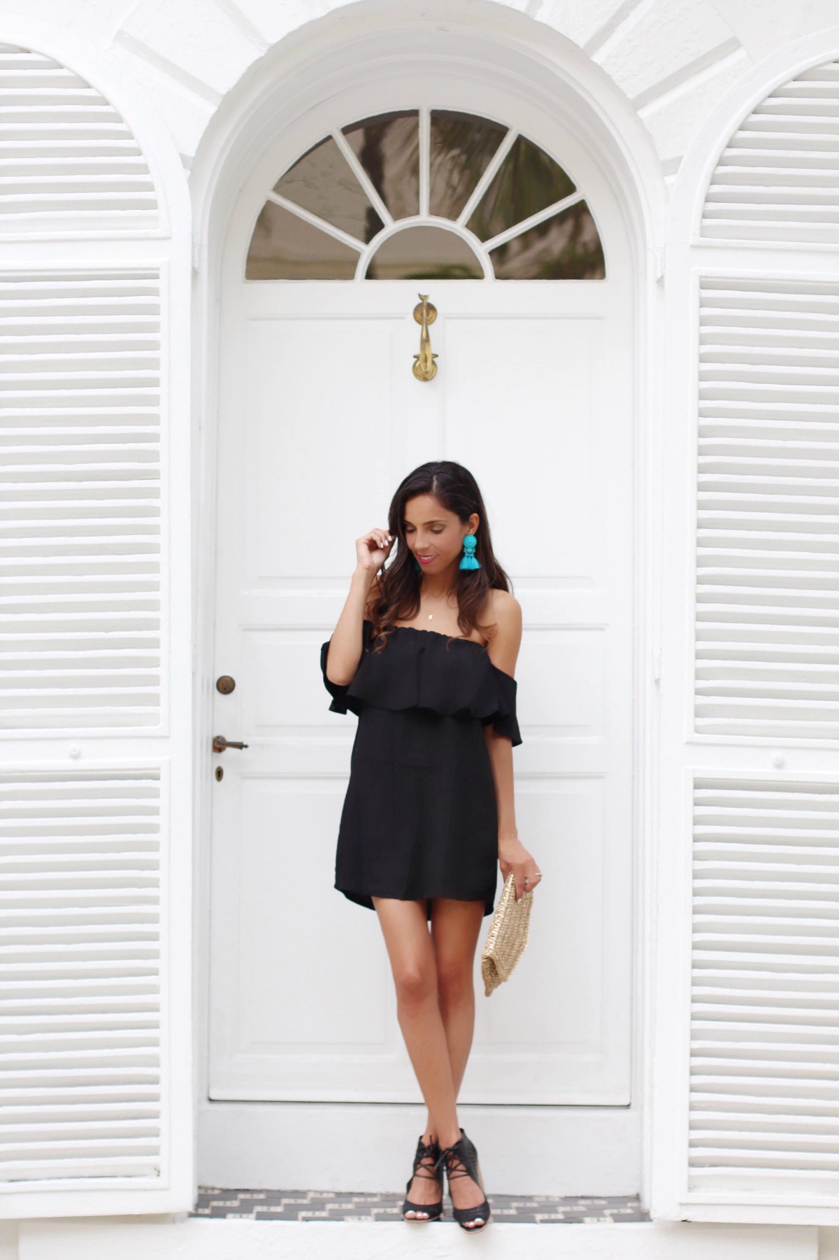 Black off the shoulder dress with turquoise accessories 