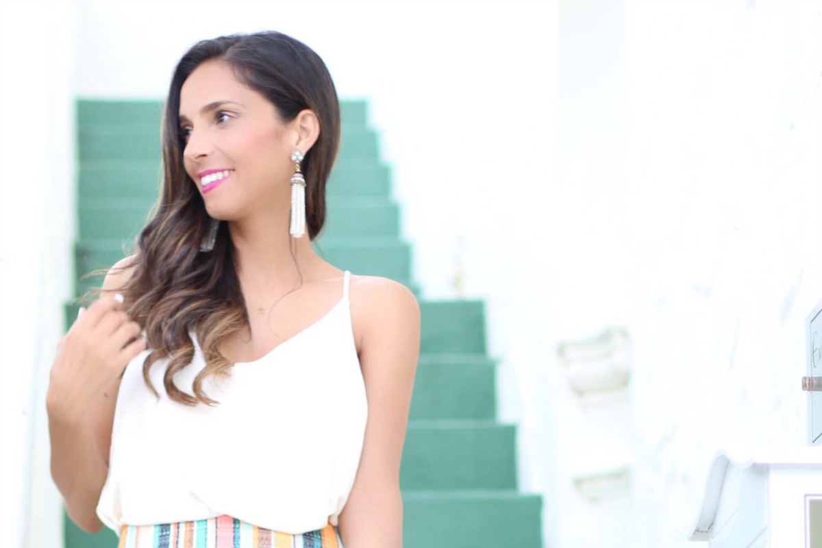 White v-neck camisole top and multicolor striped skirt in Palm Beach, FL