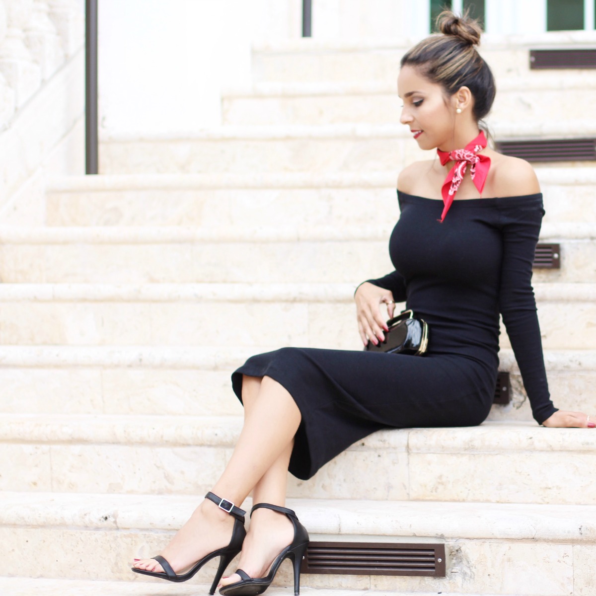 Off the shoulder little black dress with red bandanna and strappy heels