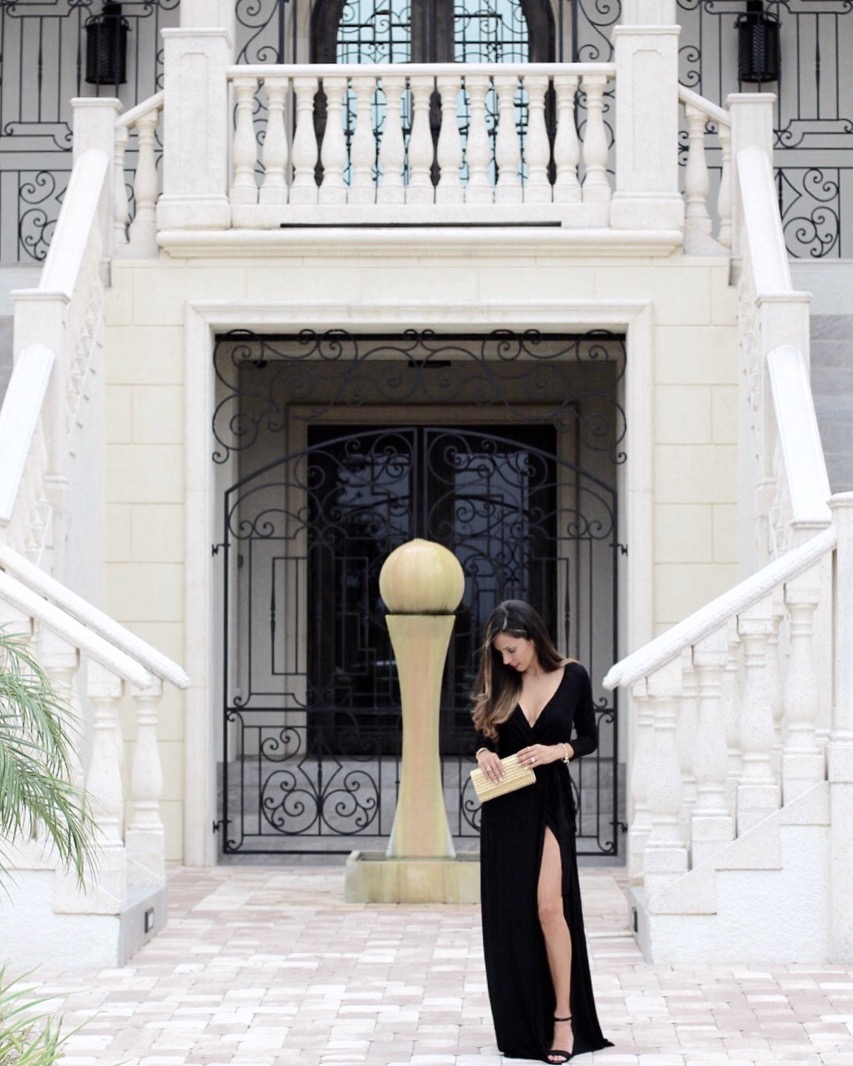 Black maxi dress with plunging neckline and high leg slit